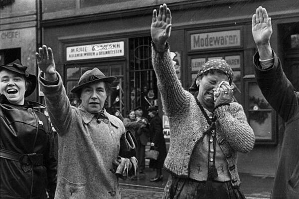 Ethnic Germans in the city of Sudetenland town of Cheb greet Hitler using the Nazi salute in 1938.
