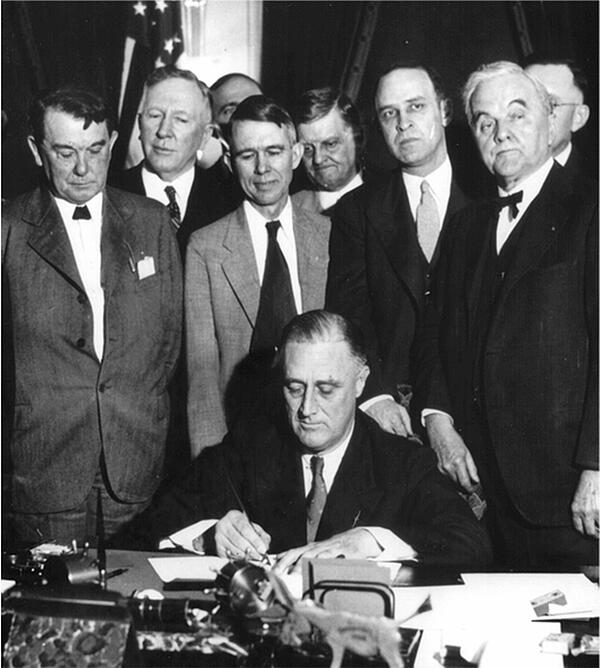 Roosevelt signing TVA Act (1933)