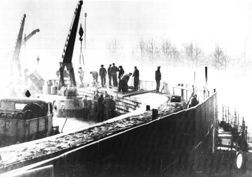The Berlin Wall being built by East German Construction Workers